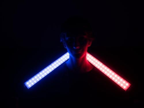 Mysterious Person in the Dark with Lightsticks